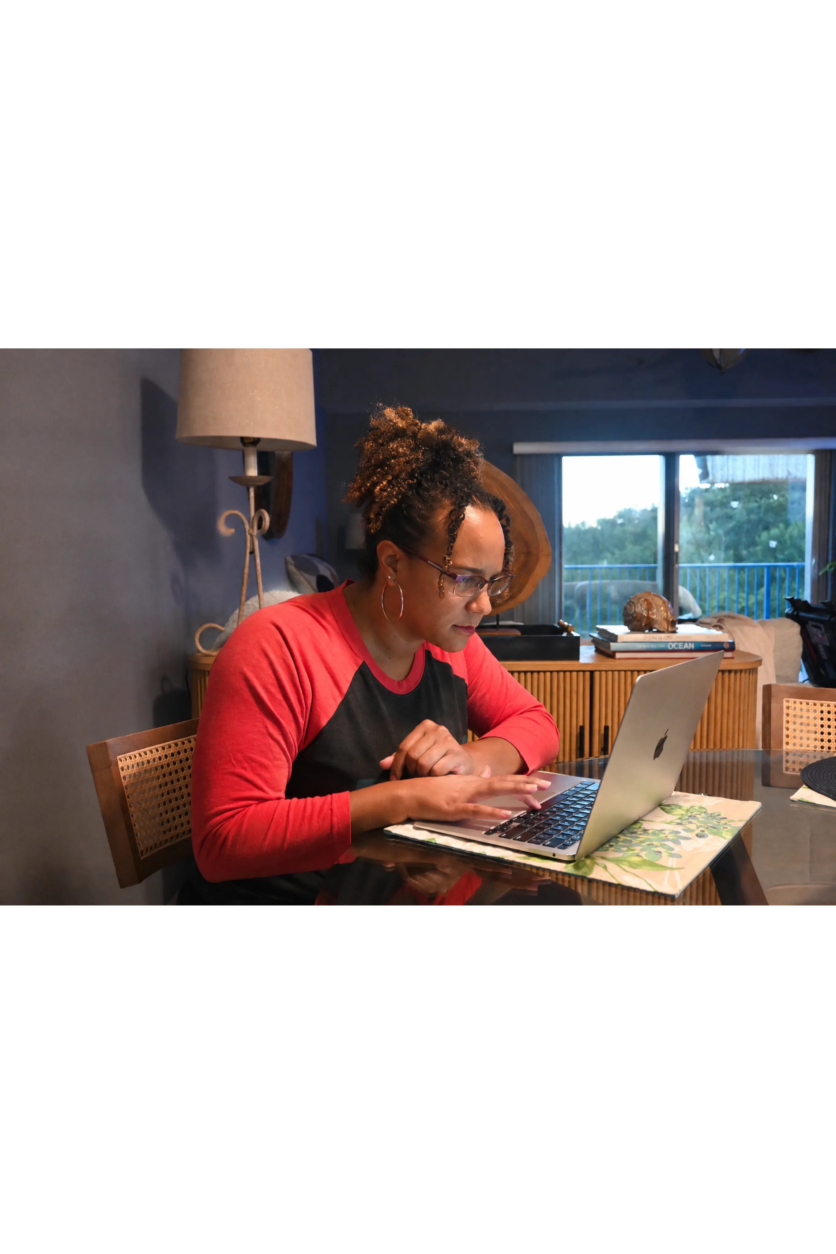 Woman working at a laptop during an online session
